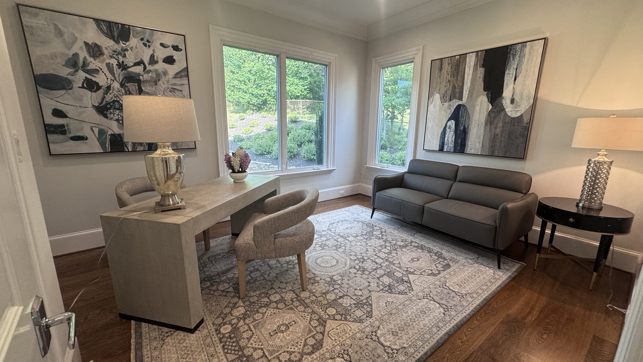 The Study: writing desk, leather sofa, large-scale art, handmade rug, designed and furnished by John Hashempour